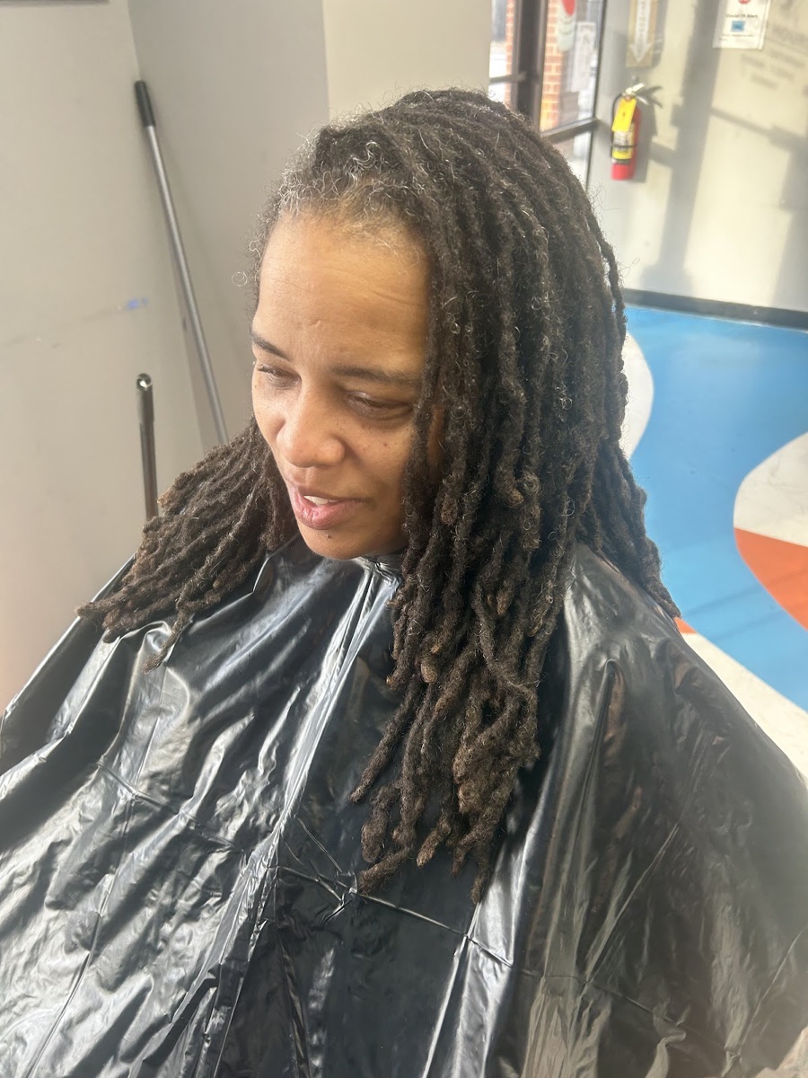 Freshly styled long locs done at the salon